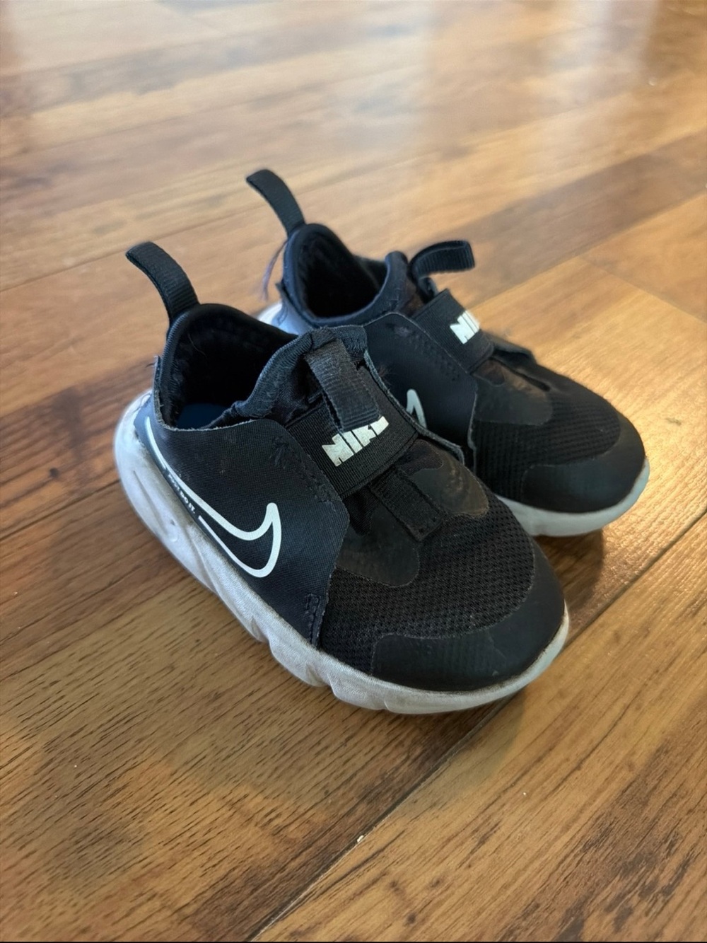Nike Kids Black and White Slip-On Athletic Sneaker